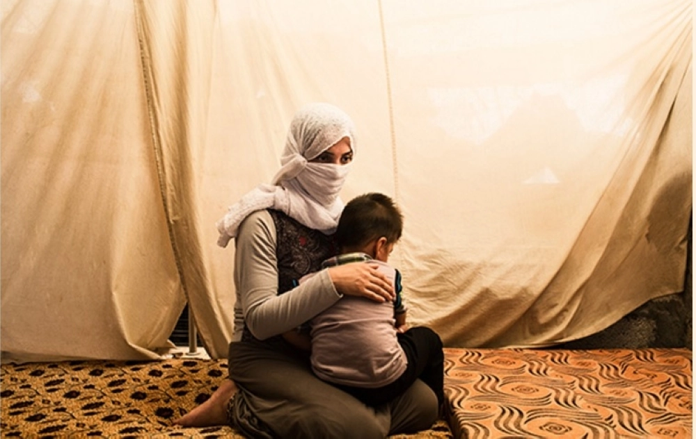 أيزيدية تمكنت من الهرب من داعش برفقة طفلها (مكة)