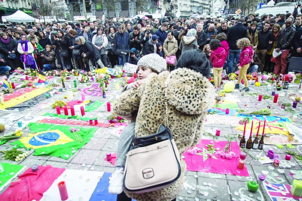 تجمع في بروكسل لتأبين ضحايا هجمات أمس الأول             (أ ف ب)