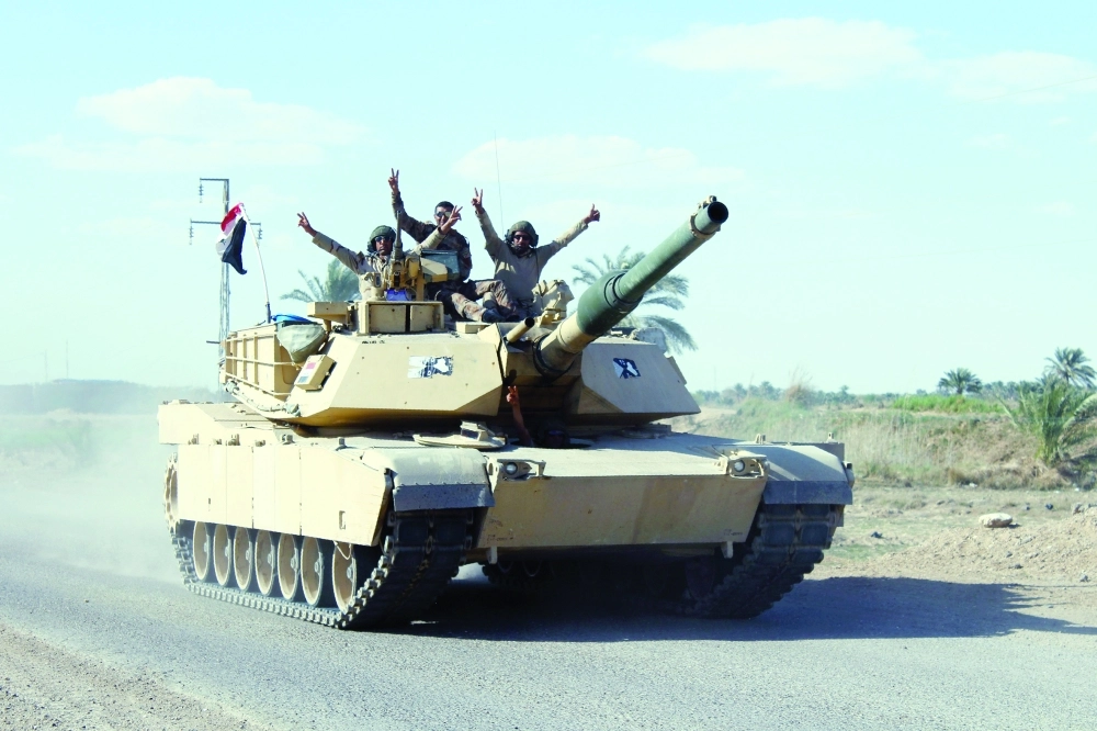 قوات عراقية خلال هجوم ضد داعش في الأنبار      (أ ف ب)