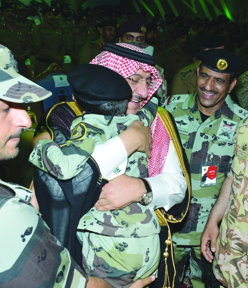 .. ومحتضنا أحد أبناء الشهداء