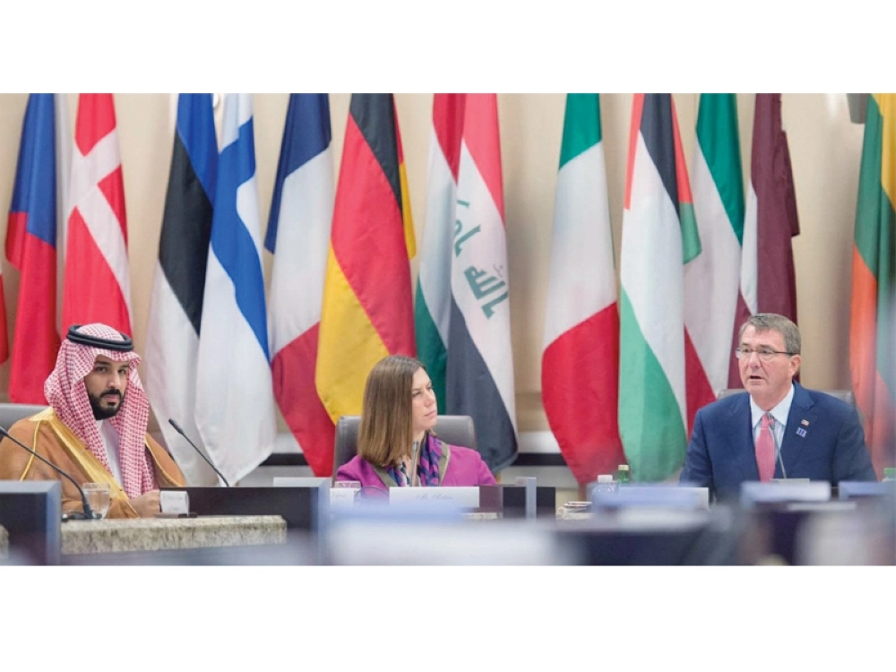 الأمير محمد بن سلمان خلال الاجتماع الوزاري للتحالف الدولي بواشنطن أمس ( أ ف ب )