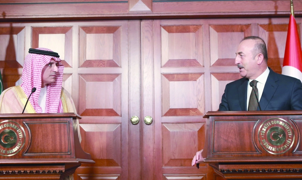 عادل الجبير ونظيره التركي في مؤتمر صحفي بأنقرة                                       (أ ف ب)