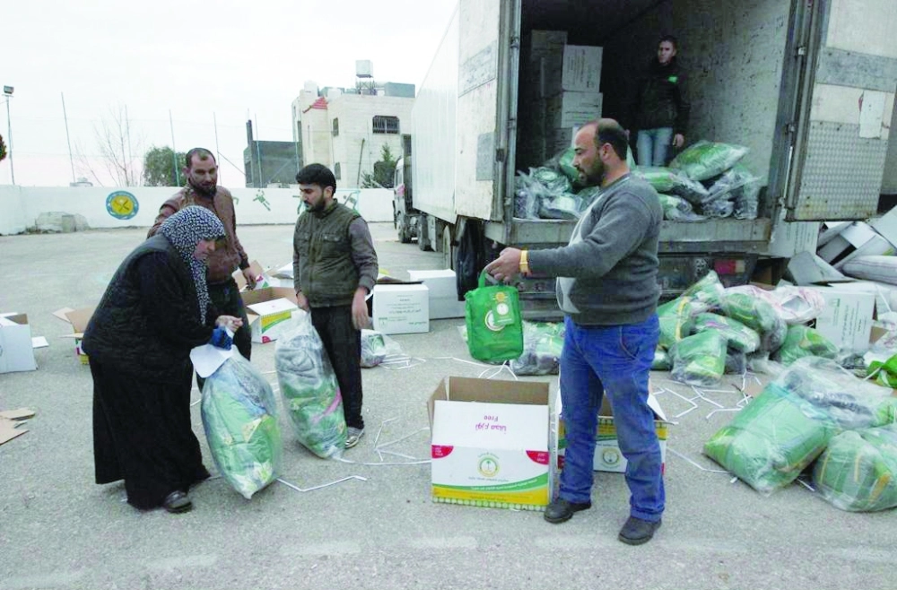 مساعدات سعودية للسوريين بالأردن (واس)