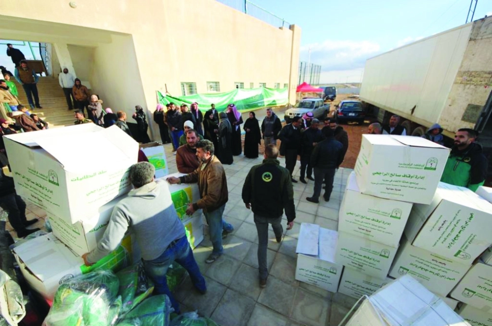 مساعدات سعودية للسوريين بالأردن                                                  (واس)