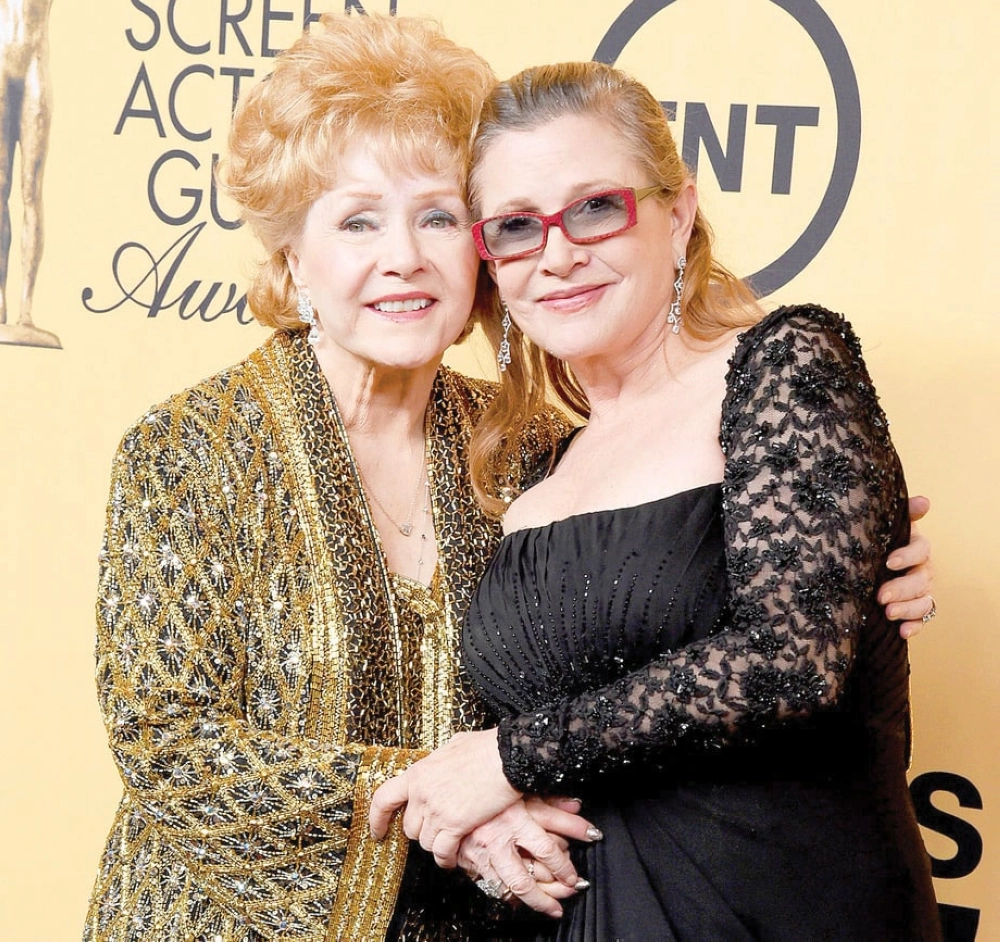 رينولدز وابنتها كاري   