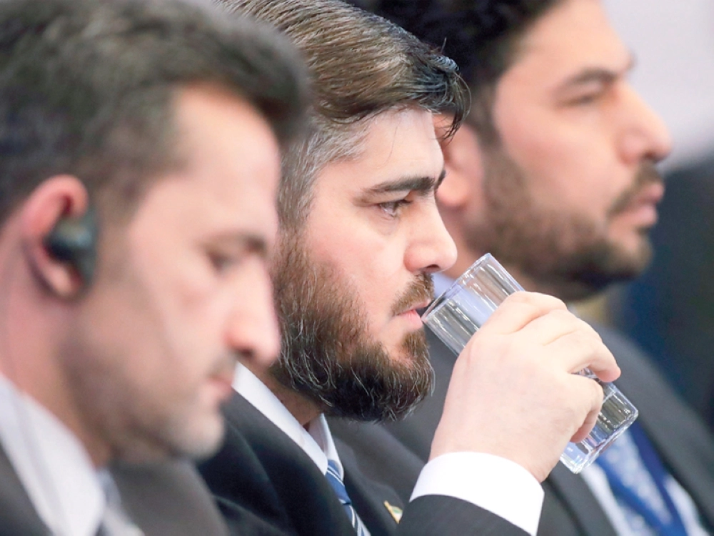 محمد علوش أثناء المحادثات بأستانة (أ ب)