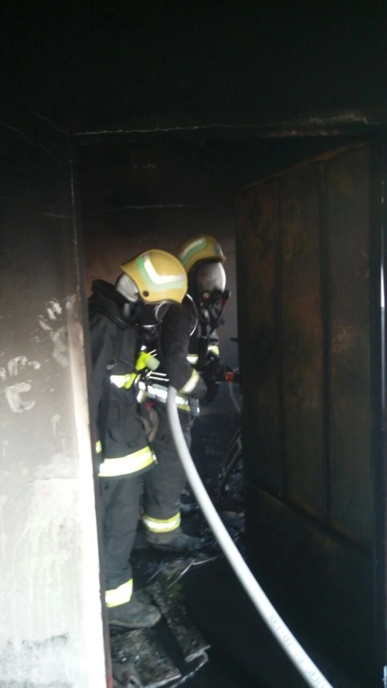 الدفاع المدني بعد إخماد الحريق (مكة)