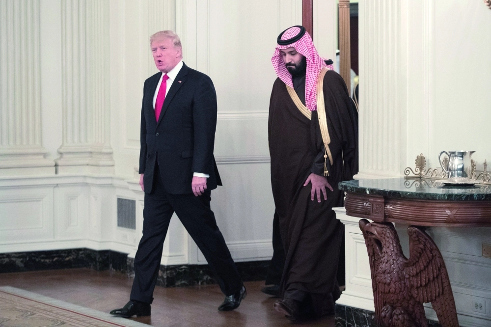 ولي ولي العهد وترمب في البيت الأبيض أمس الأول (إ ب أ)