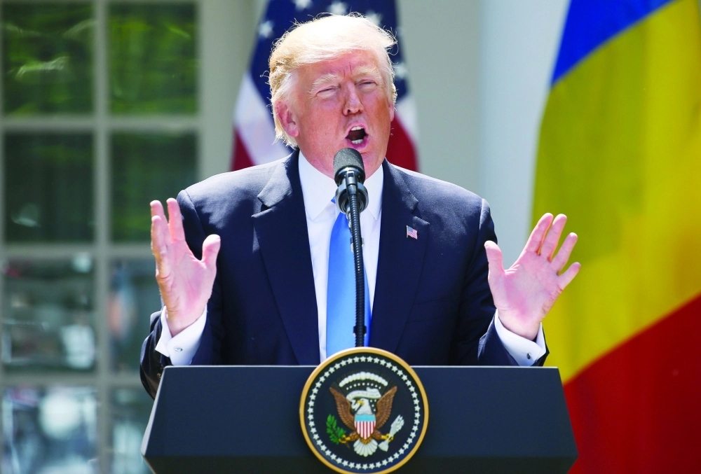 U.S. President Donald Trump addresses  joint news conference with Romanian President Iohannis at the White House in Washington
