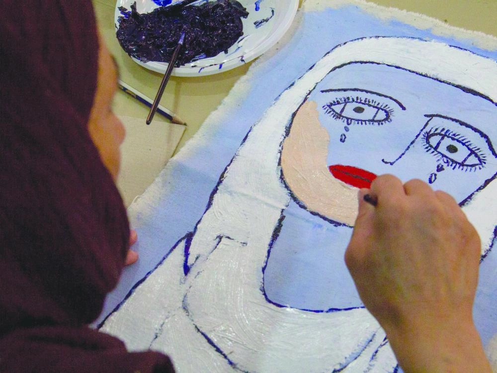 






جميلة ترسم لوحتها                                   (Business Insider)