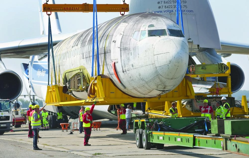 The former Lufthansa airplane "Landshut" is placed on a low-bed truck by a crane at the airport in Friedrichshafen, Germany, 23 September 2017. The airplane, which was kidnapped by terrorists in 1977 was brought to Germany from Brazil. It will be exhibited at the Dornier Museum in Friedrichshafen. Photo: Karl-Josef Hildenbrand/dpa