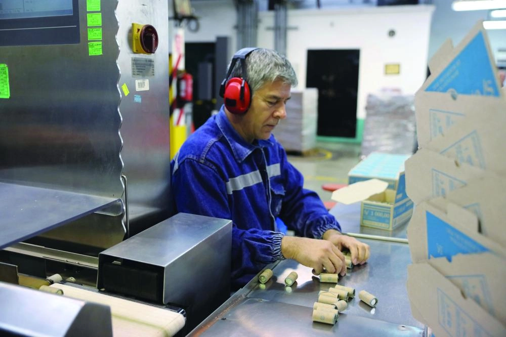 An employee places 50 cent coins in a box at La Casa de Nacional de la Moneda (National Mint House) in downtown Lima, Peru, September 20, 2017. REUTERS/ Guadalupe Pardo
