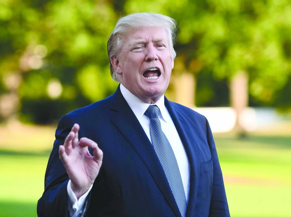 ترمب يتحدث في حديقة البيت الأبيض (إ ب أ)