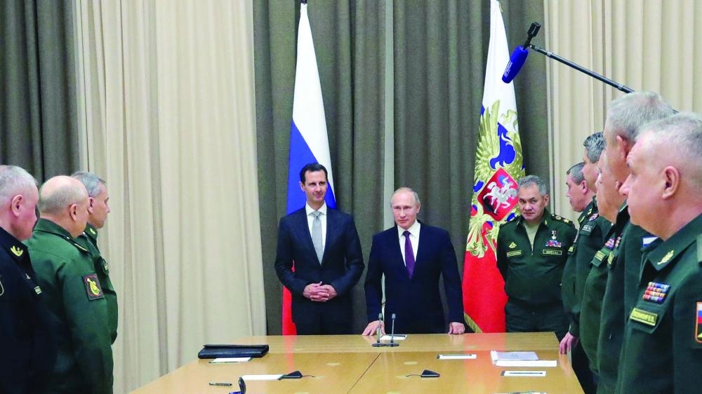 






بوتين مستقبلا الأسد في سوتشي بحضور القيادات العسكرية                                (د ب أ)