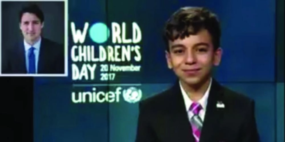 باسل متحدثا للرئيس الكندي في يوم الطفولة