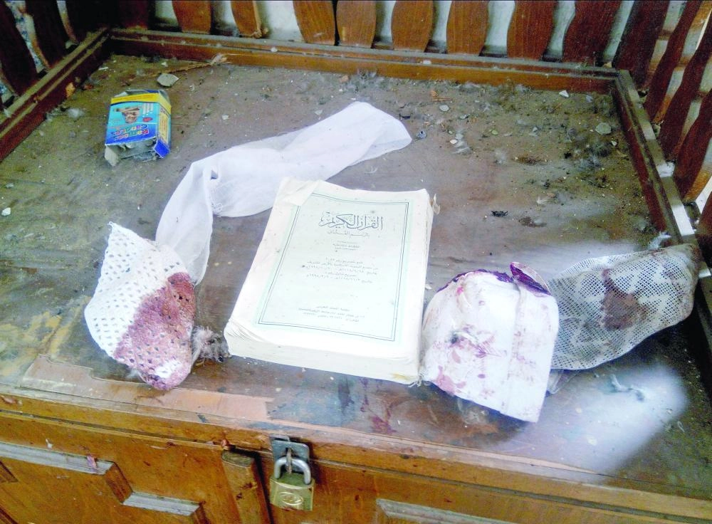 A Quran and remnants of personal belongings of victims of the explosion are seen at Al Rawdah mosque are seen in Bir Al-Abed, Egypt November 25, 2017. REUTERS/Mohamed Soliman