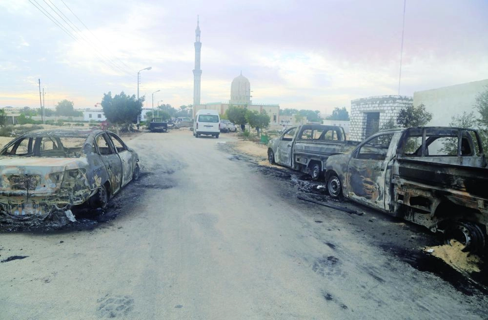 Damaged vehicles are seen after a bomb exploded at Al Rawdah mosque in Bir Al-Abed, Egypt November 25, 2017. REUTERS/Mohamed Soliman     TPX IMAGES OF THE DAY