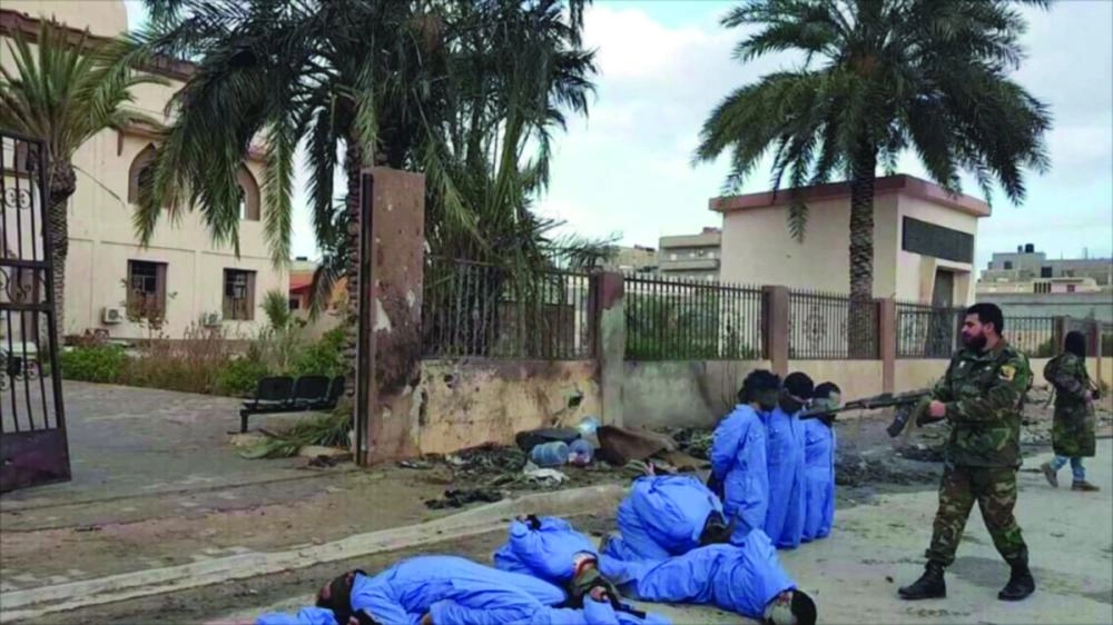 






الورفلي خلال الإعدامات الميدانية             (تويتر)  