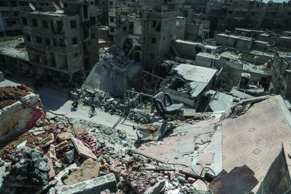 دمار خلفه القصف السوري والروسي على الغوطة الشرقية                 (إ ب أ)