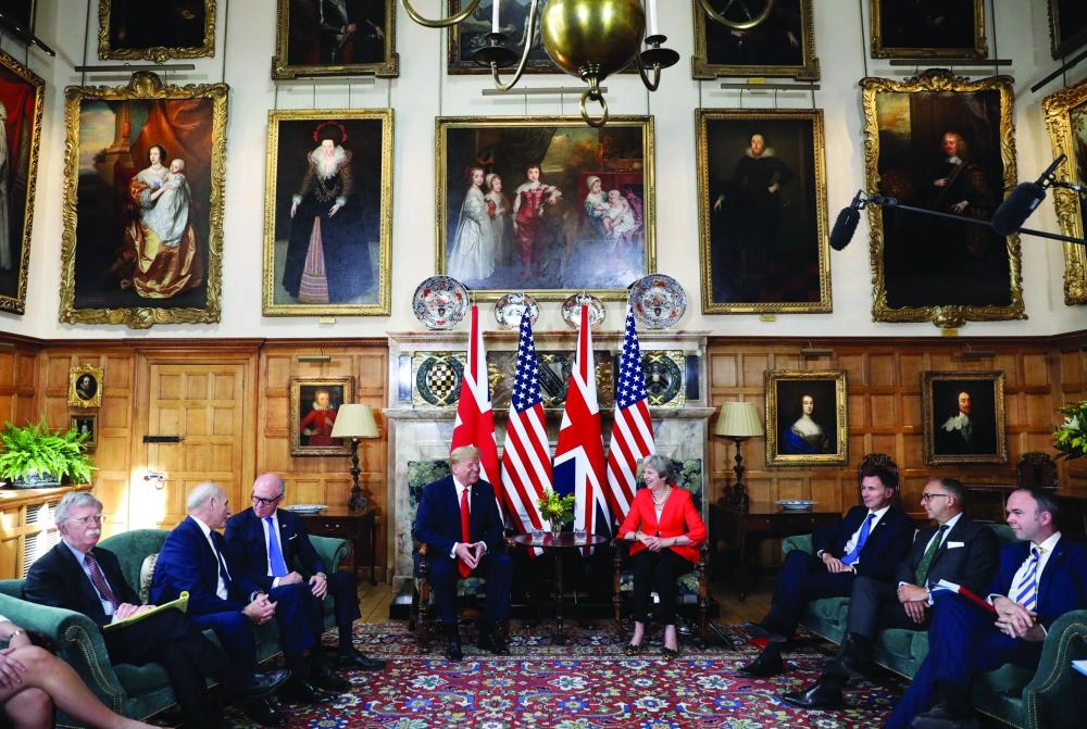 epa06885348 British Prime Minister Theresa May (C-R), US President Donald J. Trump (C-L), US national security advisor John Bolton (L), US ambassador to the United Kingdom Woody Johnson (3-L), British Foreign Secretary Jeremy Hunt (3-R) and Downing Street Chief of Staff Gavin Barwell at the start of the bilateral meeting at Chequers in Aylesbury, Britain, 13 July 2018.  US President Trump is on a three-day working visit to the United Kingdom, first trip to the country as US president.  EPA/CHRIS RATCLIFFE / POOL