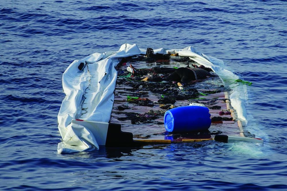 The bodies of African migrants inside a rubber boat are seen from NGO Proactiva Open Arms rescue boat in central Mediterranean Sea