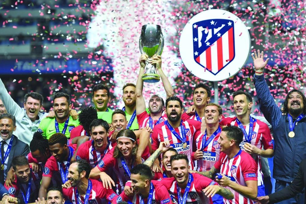 






لاعبو أتلتيكو مدريد يحتفلون بالكأس                                                 (د ب أ)