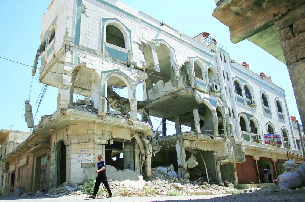 






مبان تعرضت للتدمير نتيجة قصف قوات النظام السوري العام الماضي                                                             (مكة) 