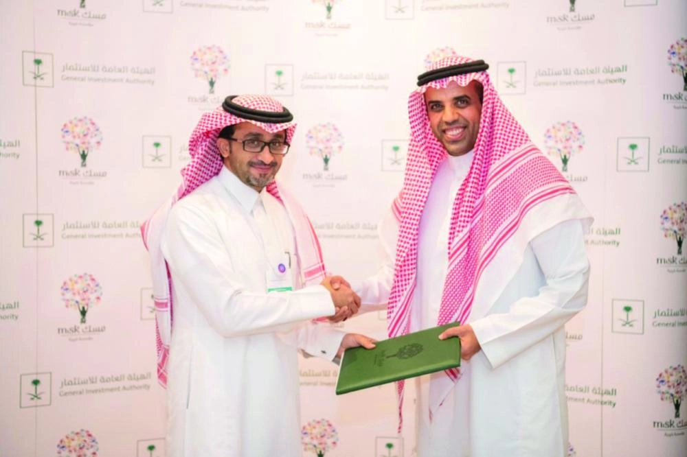 إبراهيم العمر وبدر العساكر بعد توقيع الاتفاقية (مكة)