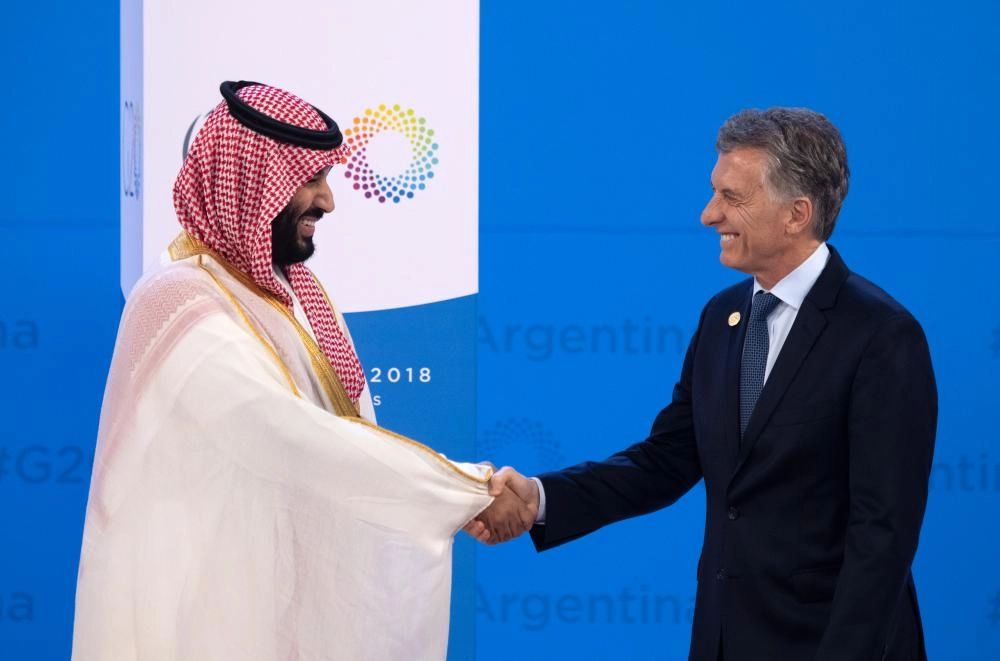30 November 2018, Argentina, Buenos Aires: Argentinian President Mauricio Macri (R) welcomes Saudi Arabia's Crown Prince Mohammed bin Salman to the G20 leaders summit. Photo: Ralf Hirschberger/dpa
