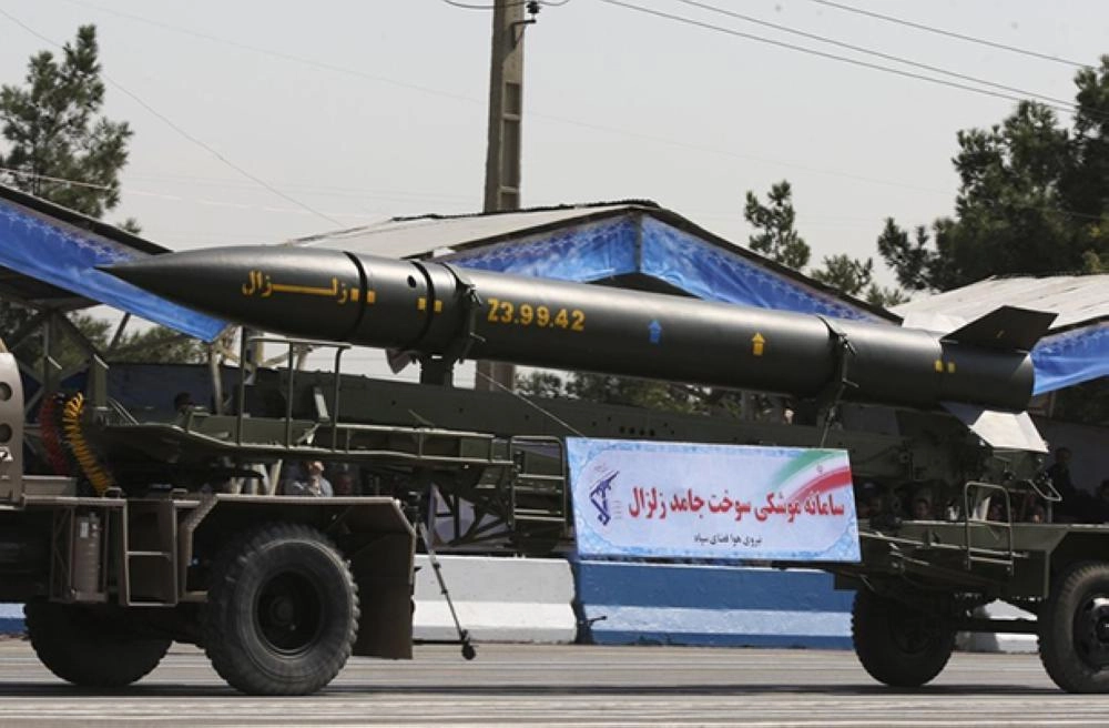 0Military vehicles carrying Fateh 110 missiles Zelzal Sam-6 Iranian Zoobin fart bomb (L) and Sagheb Shahab 2 Sejil surface-to-surface missile