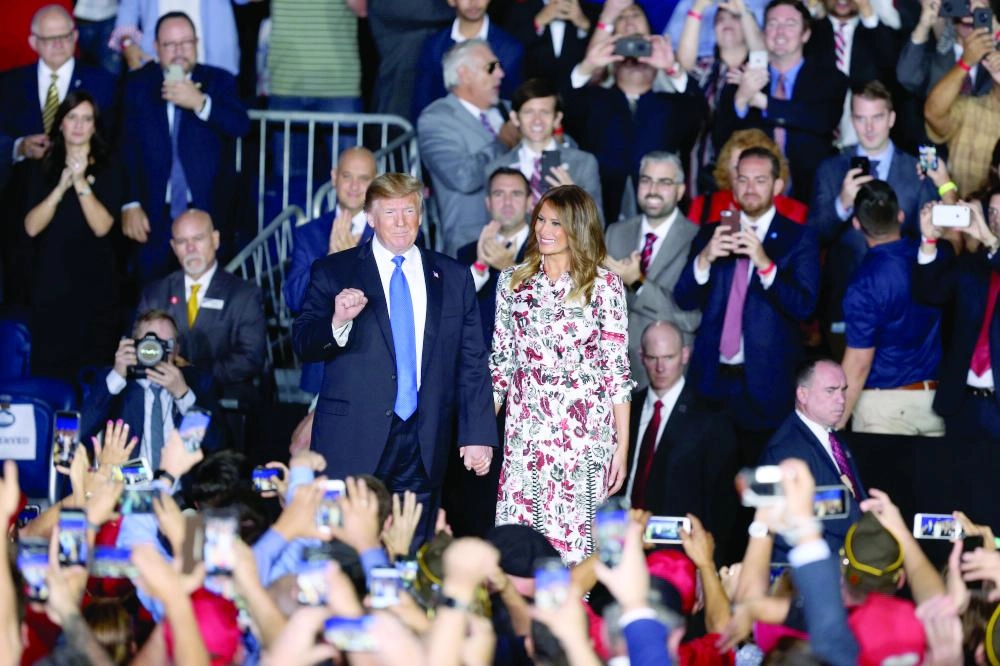 






ترمب وزوجته ميلانيا يحضران حفلا للجالية الفنزويلية في أمريكا (د ب أ)