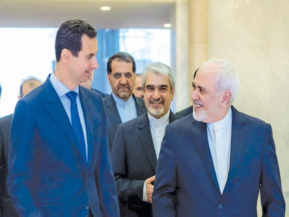 






ظريف والأسد.. ابتسامة تخفي مستقبلا غامضا                           (رويترز)