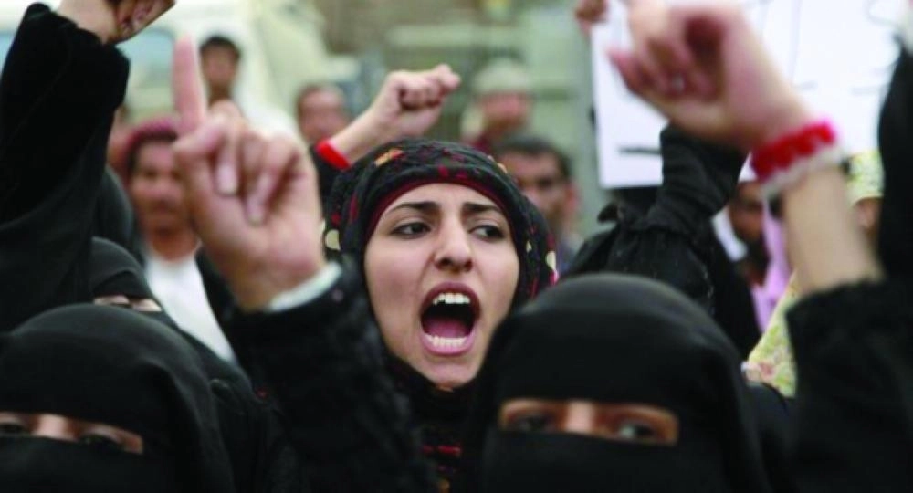 Women shout slogans during a protest demanding the ouster of Yemen's President Ali Abdullah Saleh in Sanaa