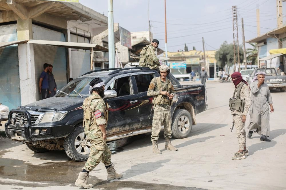 ميليشيات تابعة لـ»قسد» بعد السيطرة على المنطقة الشمالية             (د ب أ)