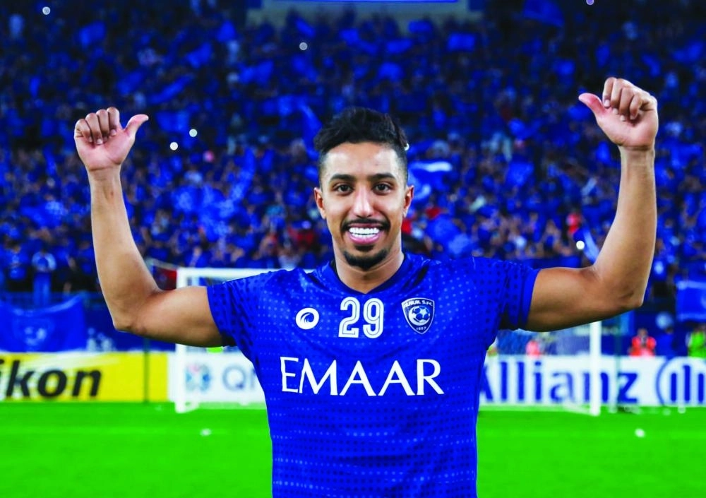 الدوسري يحتفل بالتأهل (مكة)