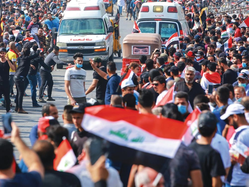 اشتباكات بين الشرطة ومتظاهرين وسط بغداد أمس  (د ب أ)