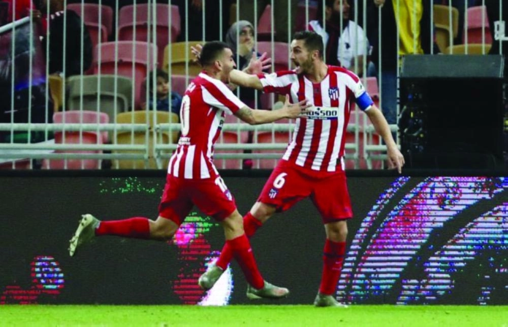 






كوكي يحتفل بالهدف الثاني في برشلونة  (موقع أتلتيكو مدريد)