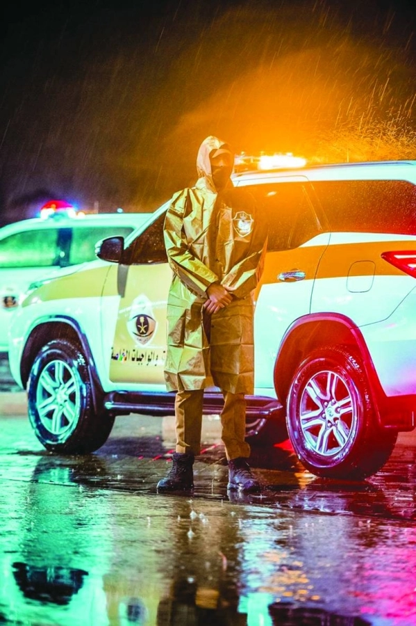 قوة المهمات والواجبات الخاصة في الأمن العام تؤدي مهامها خلال هطول الأمطار الغزيرة التي شهدتها المملكة

