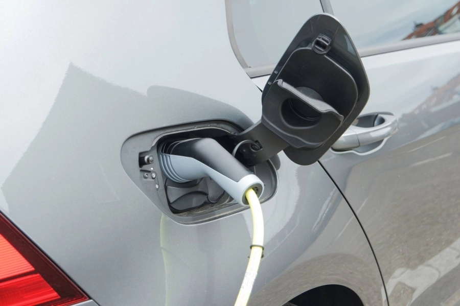 electric-car-at-the-charging-station-with-plug-in-2022-08-01-02-04-23-utc