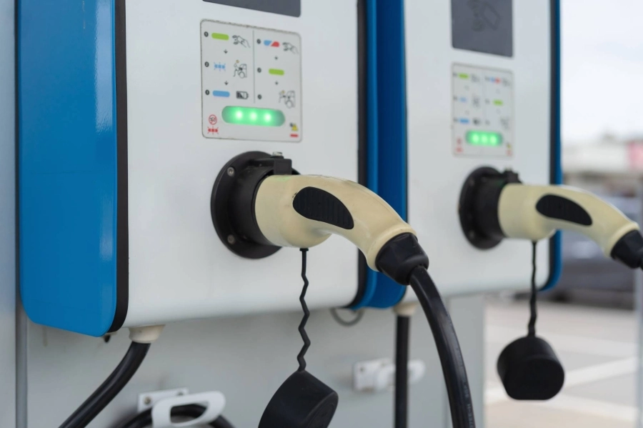 Cable from EV car charger or electric vehicle station. Cable connected at gas station, power supply battery charging an alternative eco environment future technology energy innovation