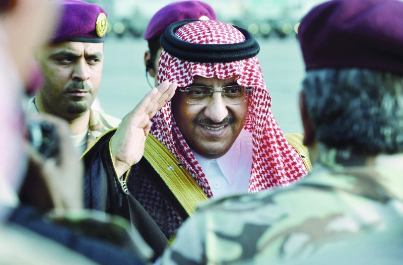 الأمير محمد بن نايف خلال رعايته عرضا عسكريا لوحدات قوات الأمن الخاصة العام الماضي (واس)