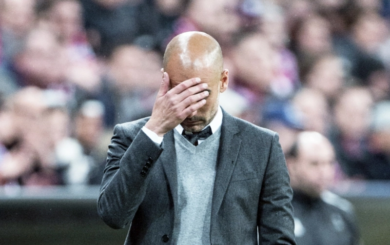 جوارديولا متأسفا على الهزيمة أمام أتلتيكو مدريد (أ ف ب)