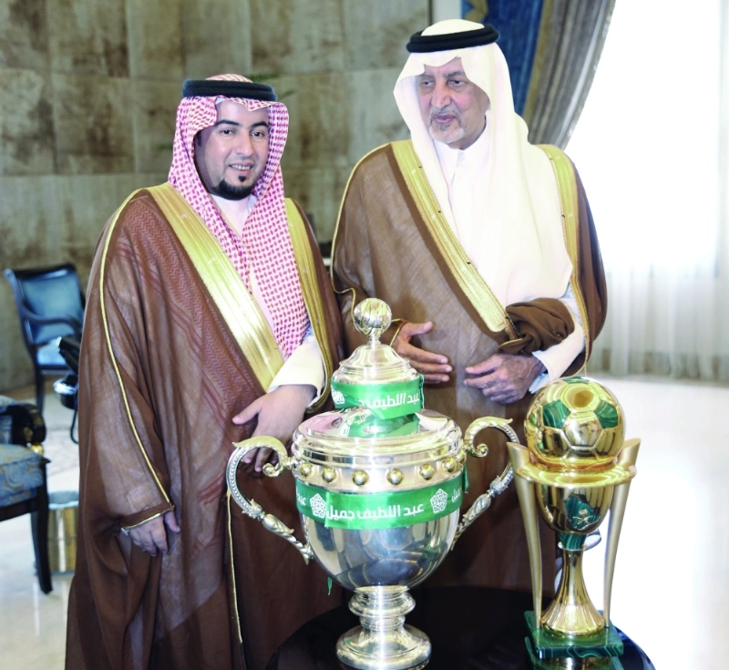 .. ومع مساعد الزويهري إلى جانب كأسي الملك والدوري