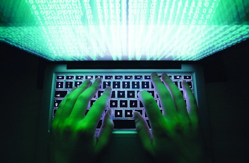 Illustration file picture shows a man typing on a computer keyboard in Warsaw