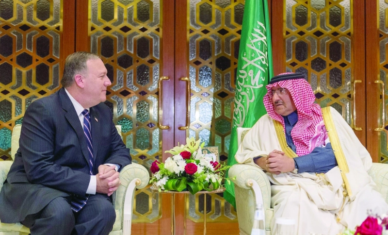 الأمير محمد بن نايف في حديث مع مدير وكالة الاستخبارات الأمريكية أمس في الرياض (واس)