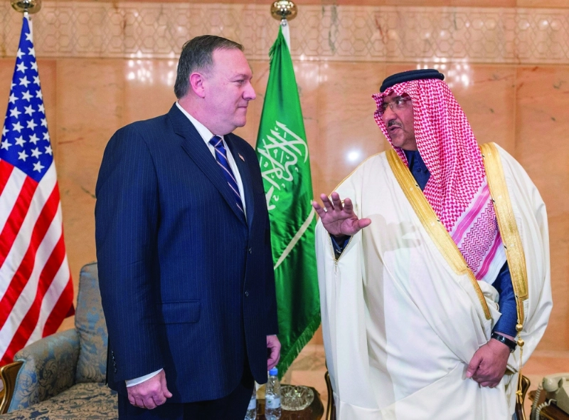 الأمير محمد بن نايف في حديث مع مدير وكالة الاستخبارات الأمريكية أمس في الرياض (واس)
