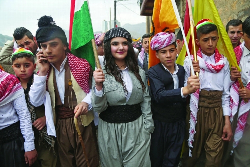 أكراد يحتفلون بالسنة الكردية في كردستان (إ ب أ)