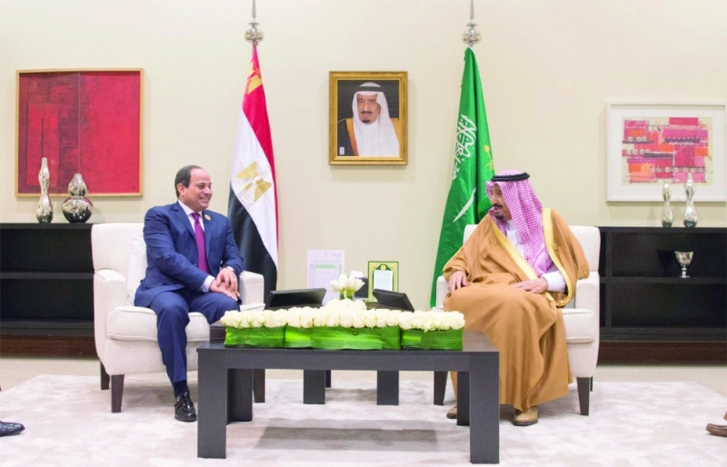 الملك سلمان والرئيس السيسي على هامش القمة العربية بالأردن مارس الماضي (واس)