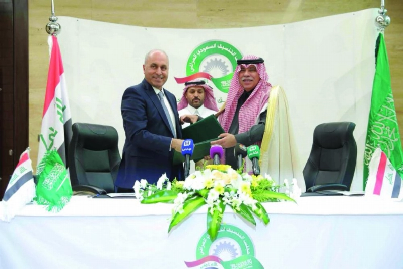 ماجد القصبي وسلمان الجميلي بعد توقيع الاتفاقيات