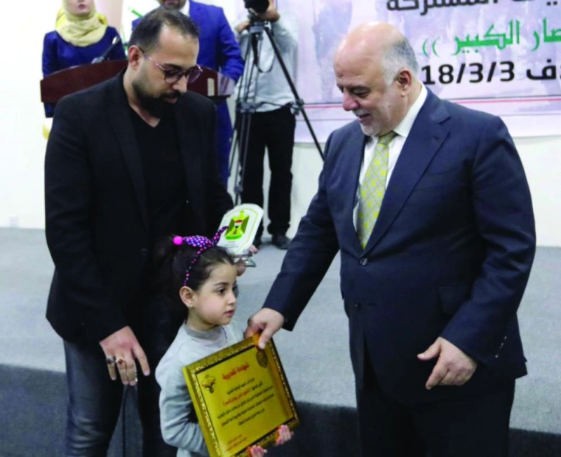 العبادي خلال الاحتفال أمس (تويتر)